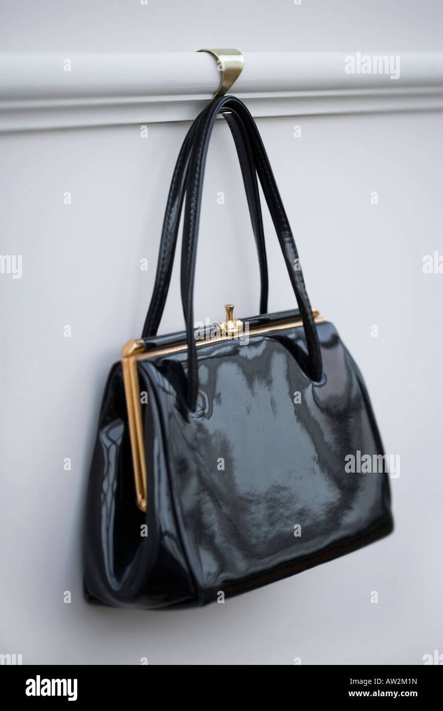 Black Patent leather kelly bag style handbag Stock Photo