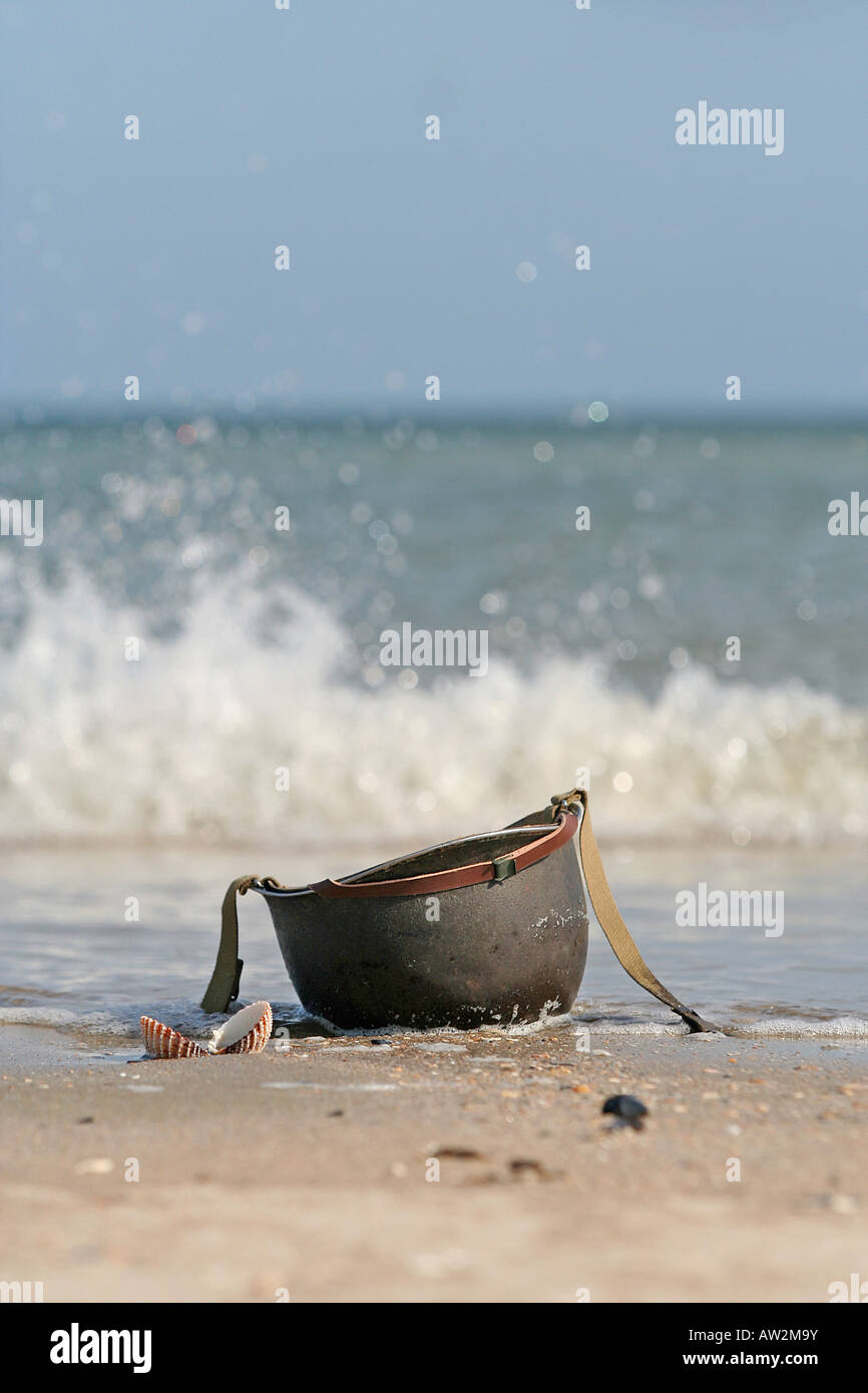 World War 2 American Helmet on Utah Beach Normandy France d-day anniversary Stock Photo