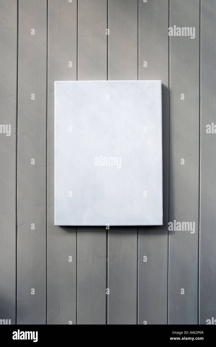 Blank canvas hanging on a wall Stock Photo