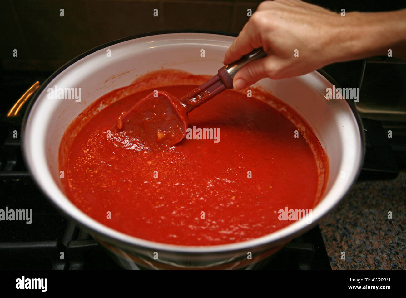 Hand stirring sauce hires stock photography and images Alamy