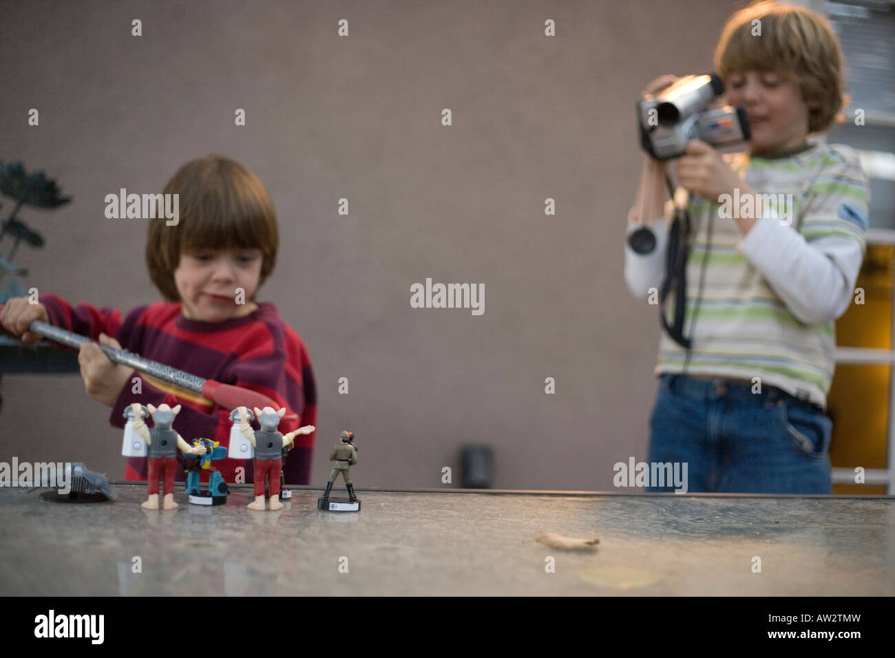 two boys making home movie together Stock Photo