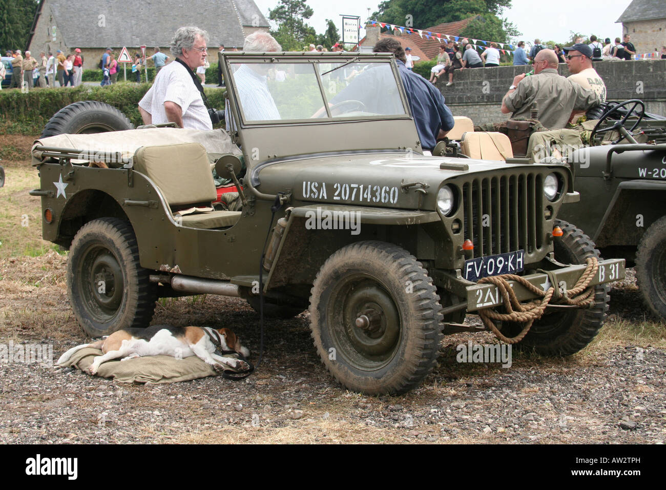 Willys Jeep Ste Mere Eglise re-enactors for 60th Anniversary dog tired d-day anniversary Stock Photo