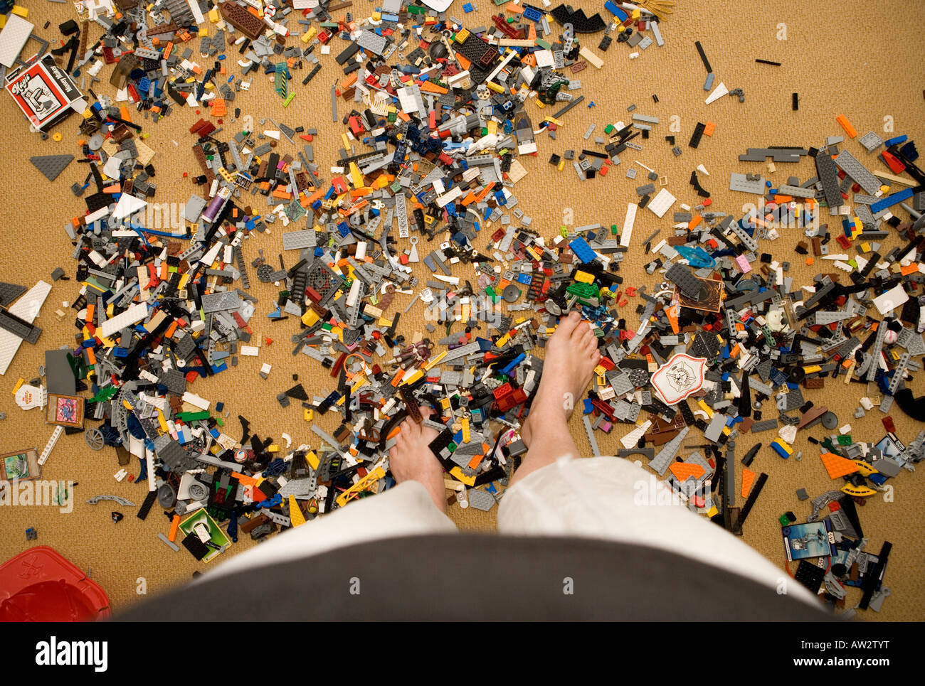 feet stepping on lego building blocks Stock Photo Alamy