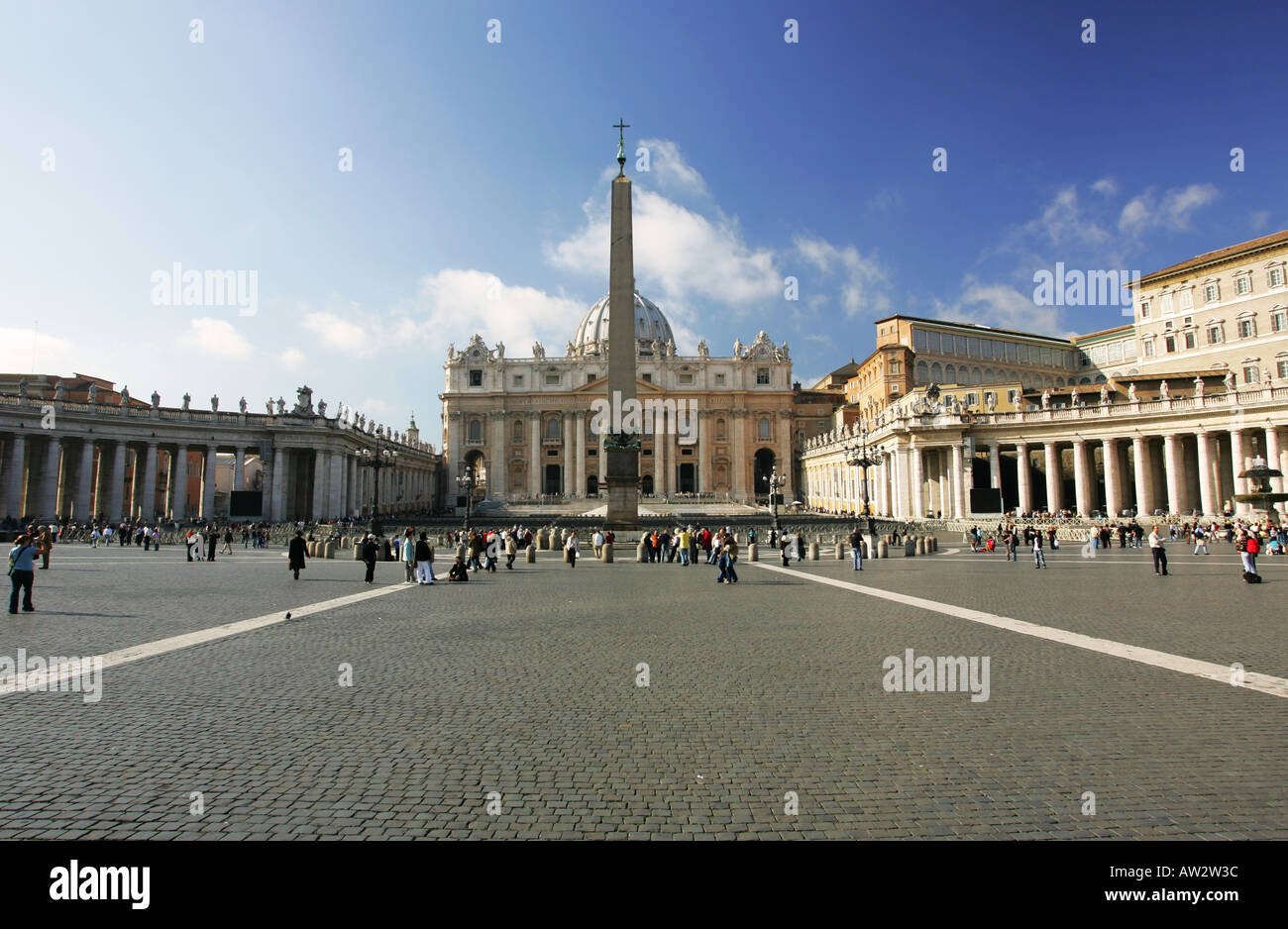 St Peters Square Piazza San Pietro Basilica tourists obelisk Vatican City Rome Italy European vacation destination Stock Photo