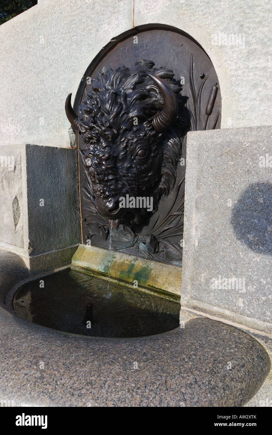 Detail of Bison head fountain on the base of the Soldier and Indian Guide statue on the grounds of the Iowa State Capitol Stock Photo