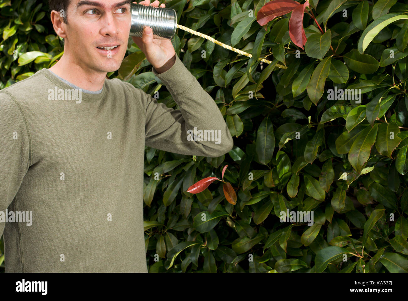 Concept of young man listening to nature on environmental issues. Stock Photo