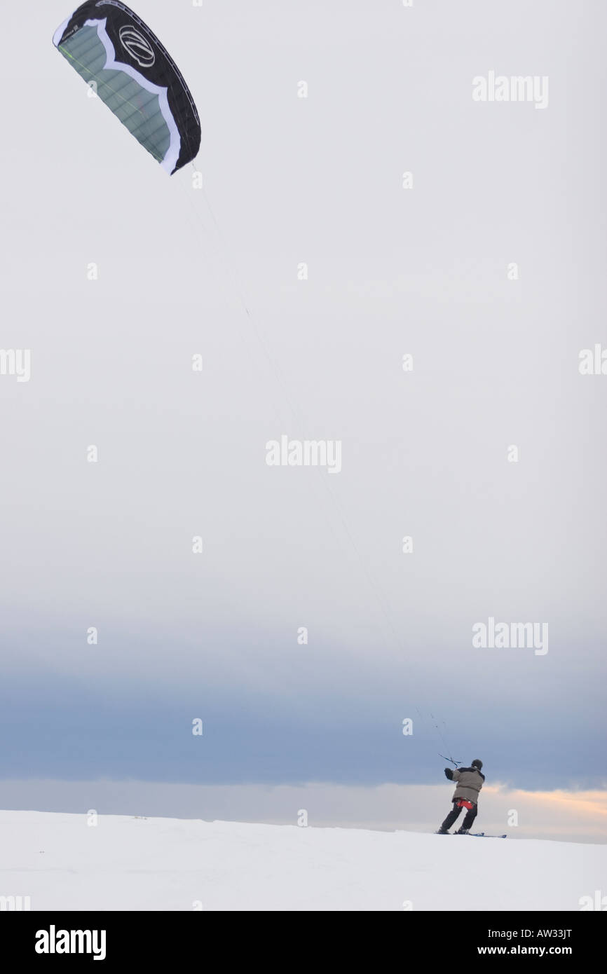Man kiteskiing under grey overcast skies near Boise Idaho Stock Photo