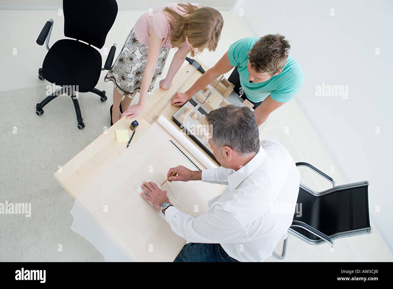 Female architects discussing work over hi-res stock photography and ...
