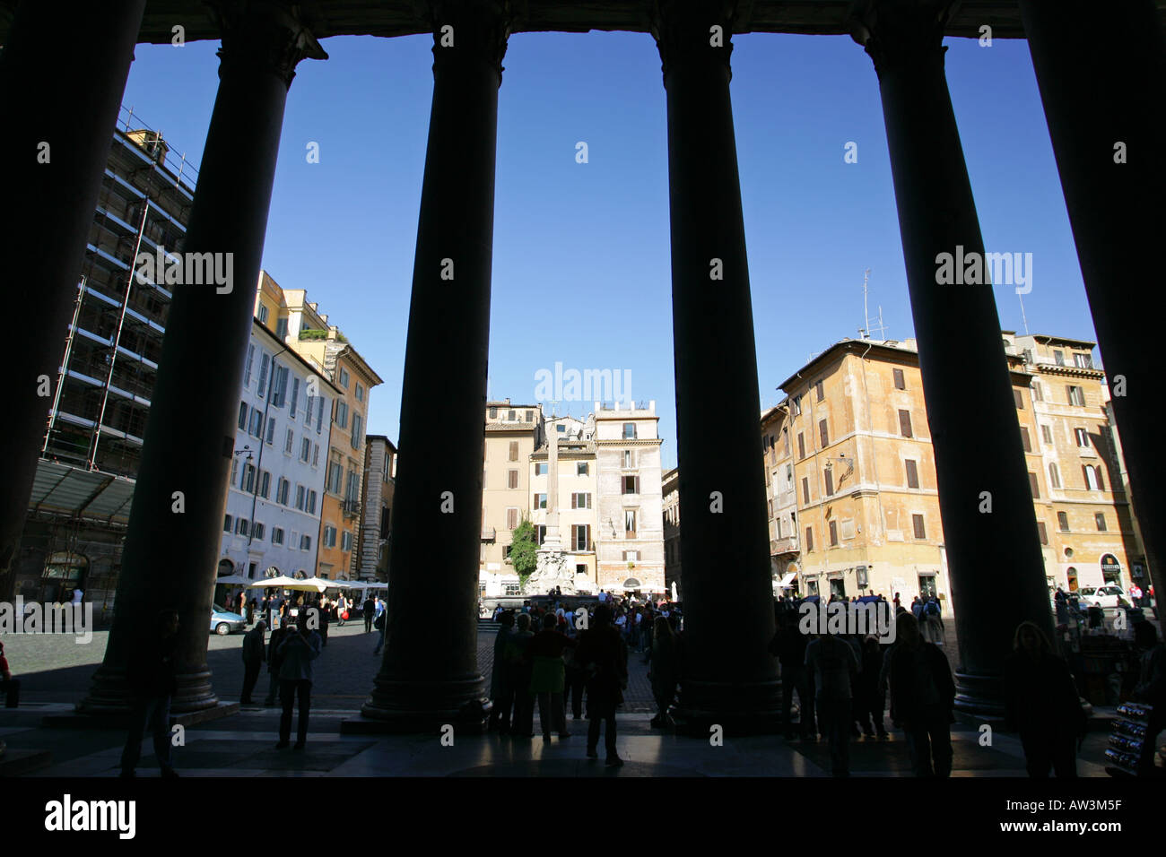 Tourists enter the famous ancient Pantheon building between corinthian stone columns in silhouette, Rome Italy Europe Stock Photo