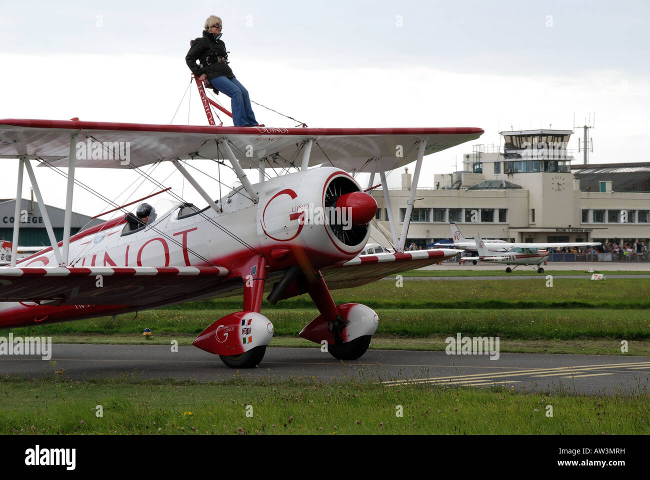 A  guinot wingwalker standing on an airplane waiting to go down the runway. Stock Photo