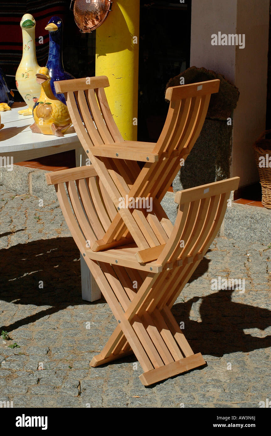 Traditional scissor chairs made from chestnut wood for sale in the town of Monchique in Faro District in Algarve the southernmost region of Portugal Stock Photo