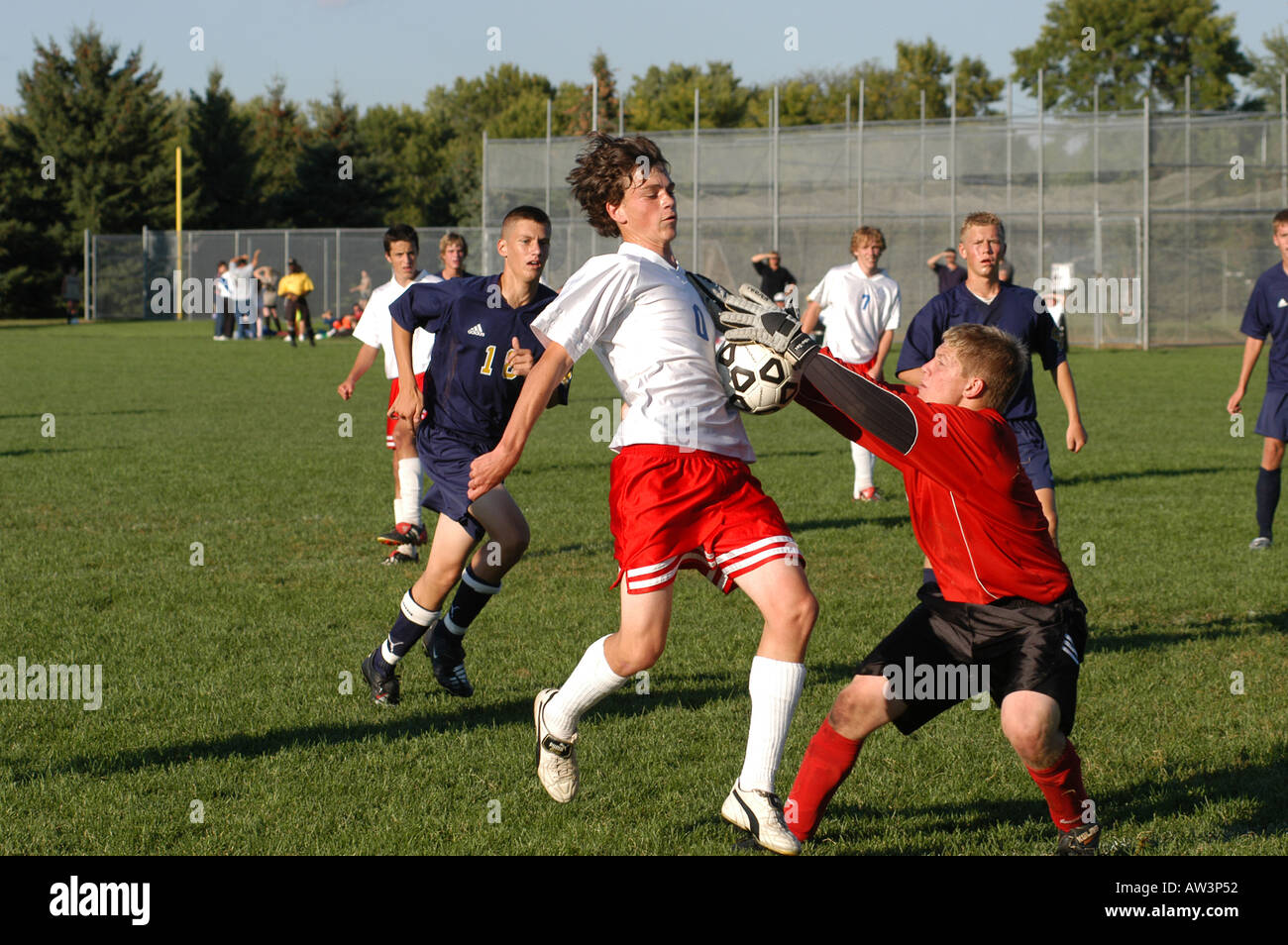 High school soccer goalie grabs ball Stock Photo Alamy