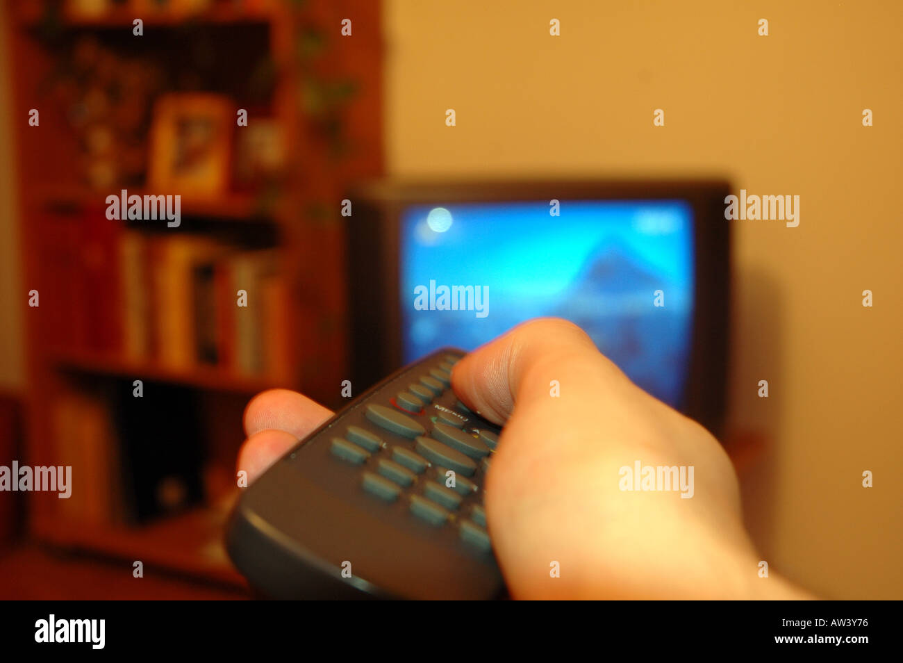 Hand with remote control Stock Photo