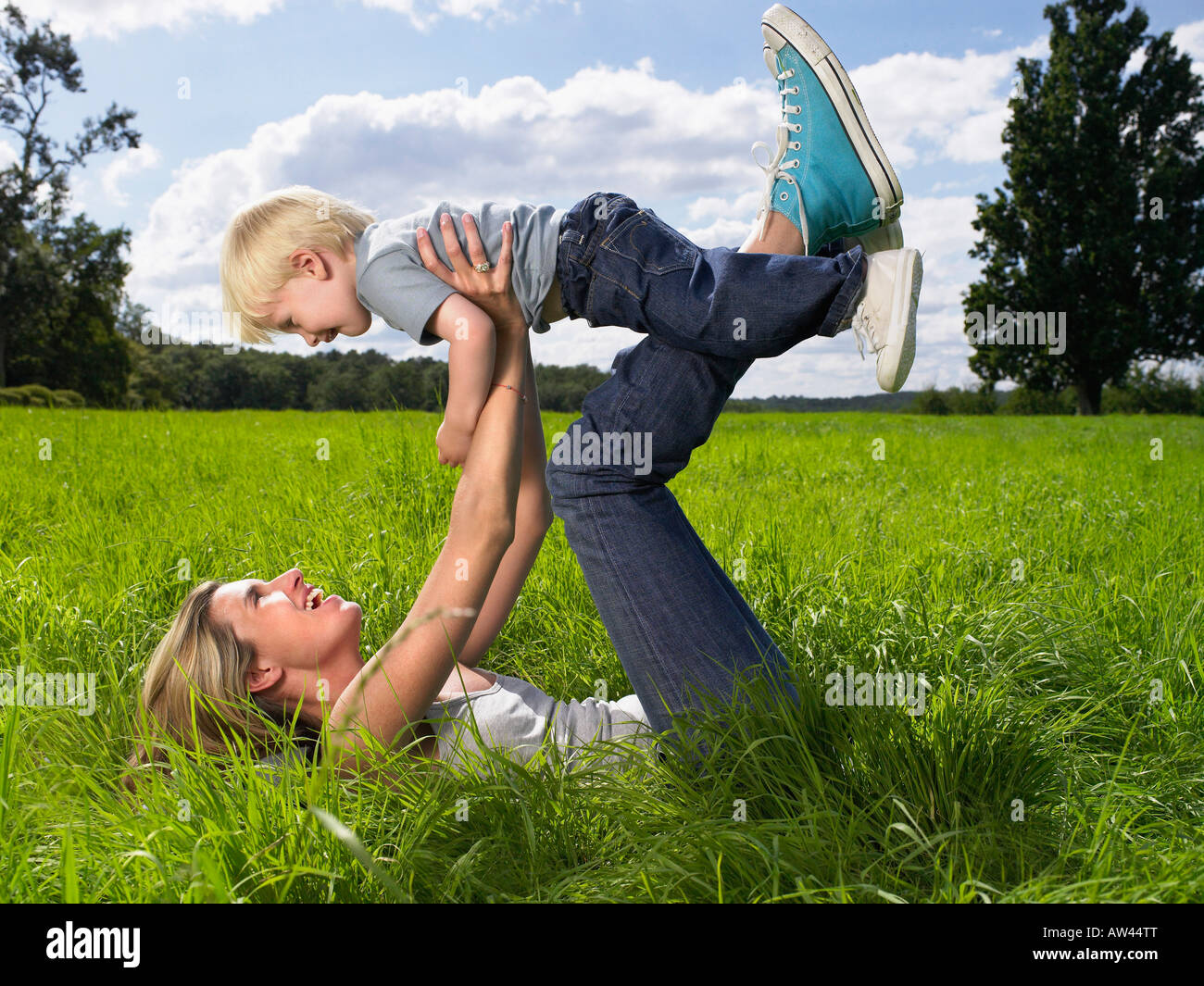 Mother and son playing in a field Stock Photo - Alamy