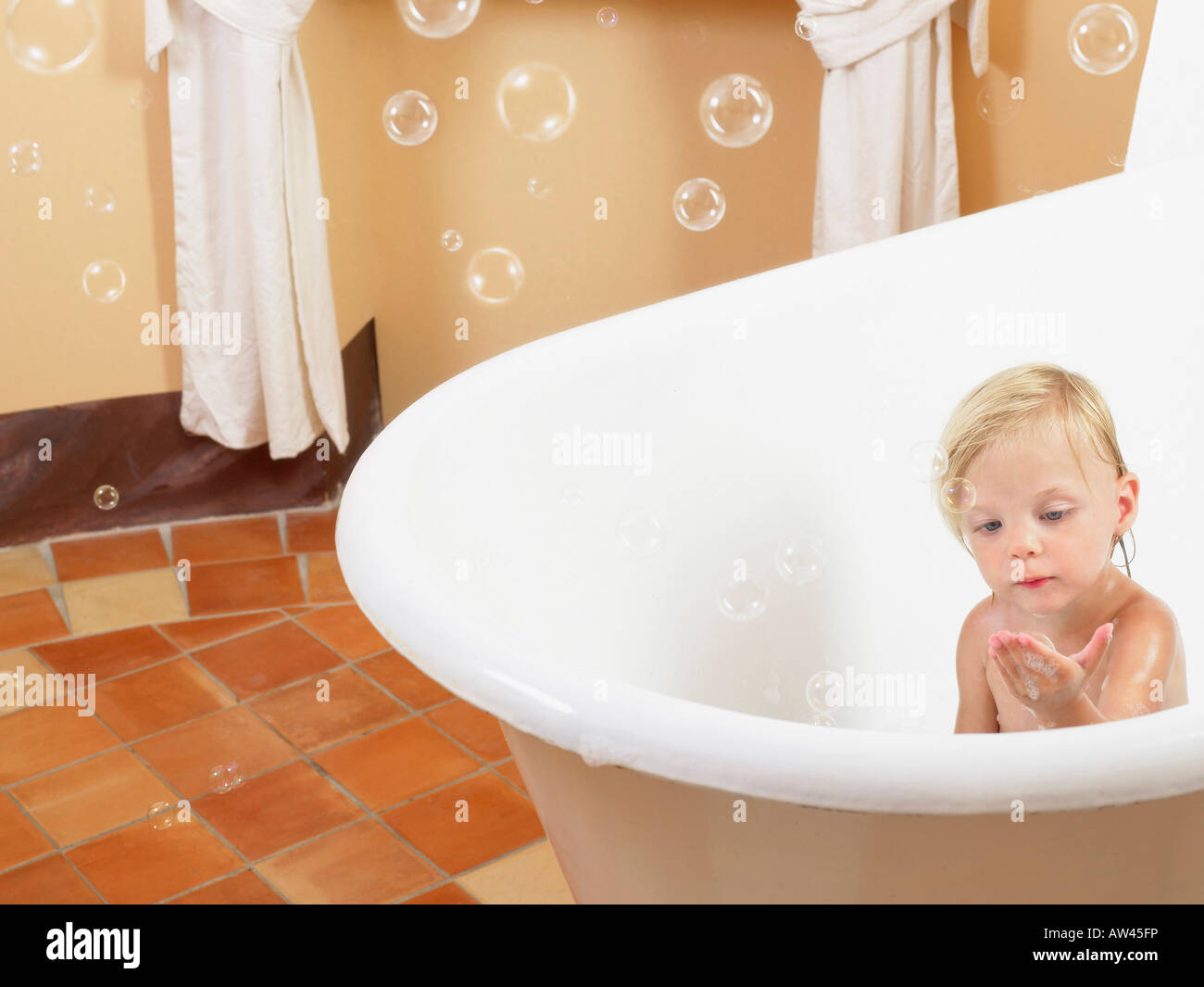Little girl taking a bath bubbles. Stock Photo