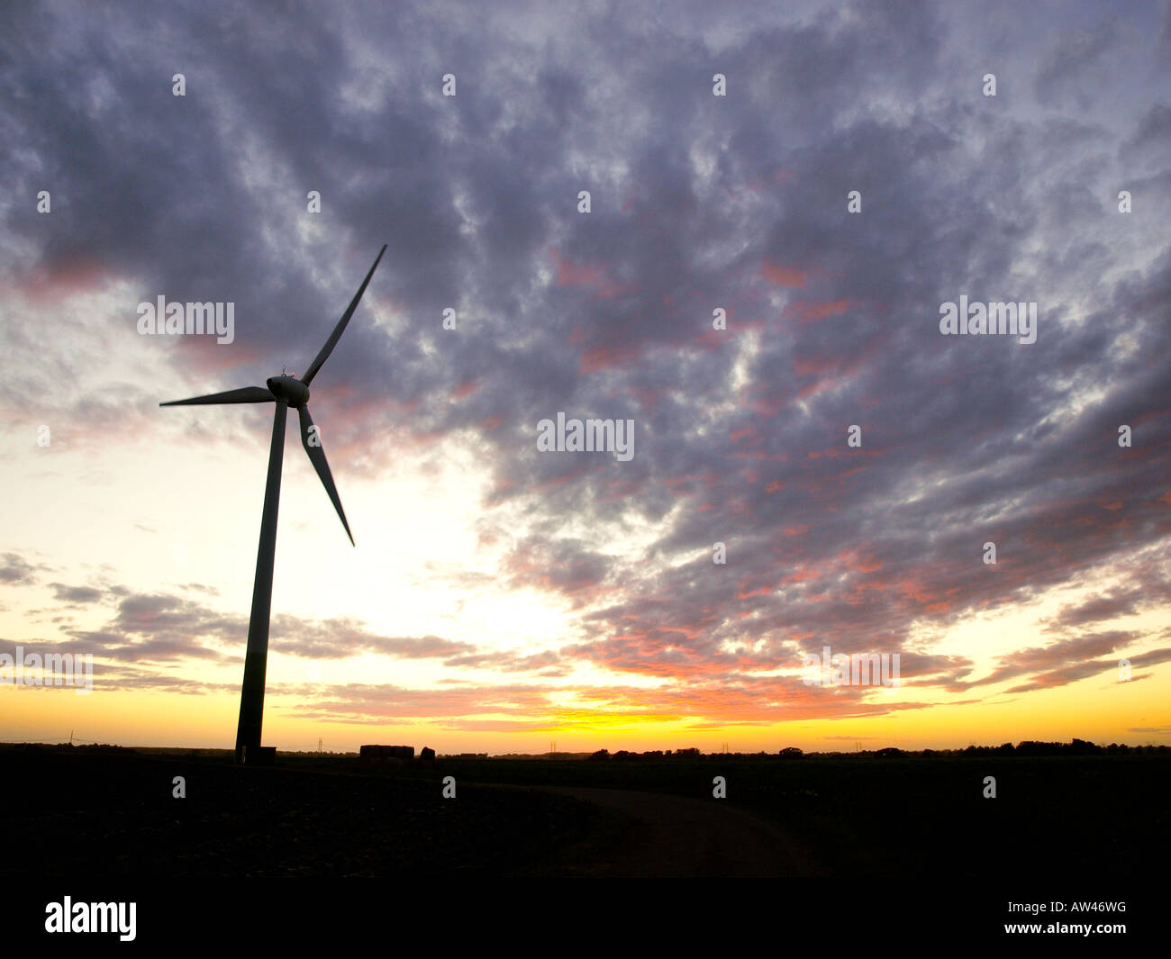 A wind turbine at sunset near Lund, Sweden. Stock Photo
