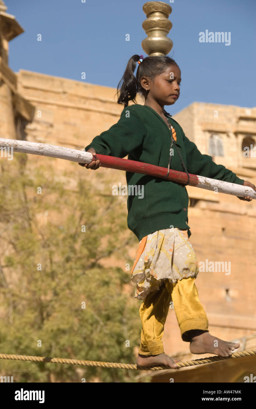 Portrait of an Indian girl making a living as a tightrope walker. Stock Photo
