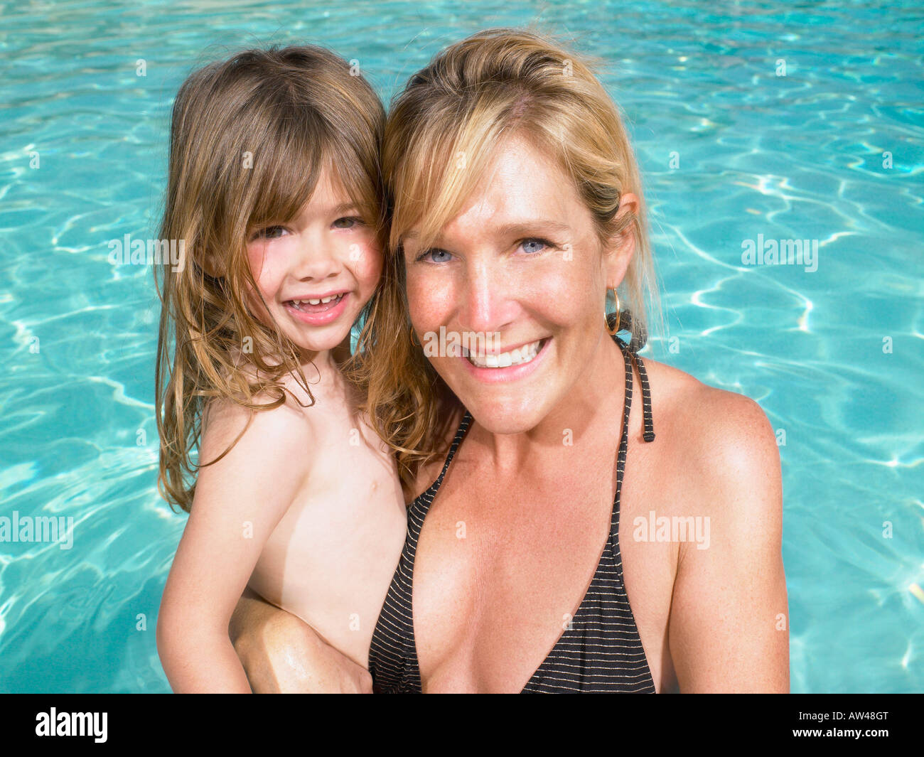 Mother and daughter in pool. Stock Photo
