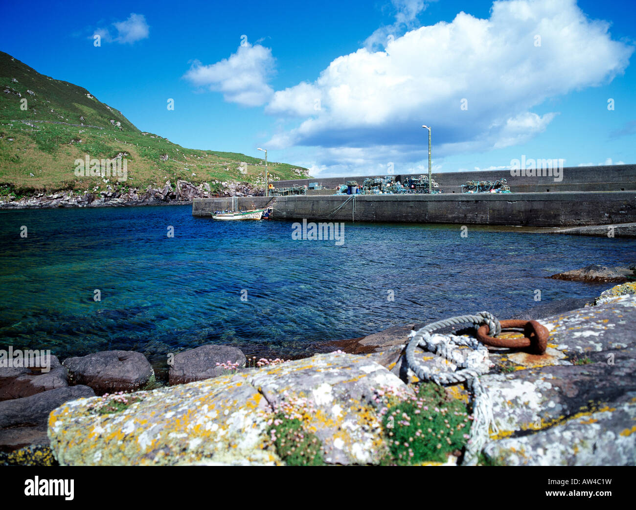 sheltered atlantic sea inlet and pier on irelands south west coast ...
