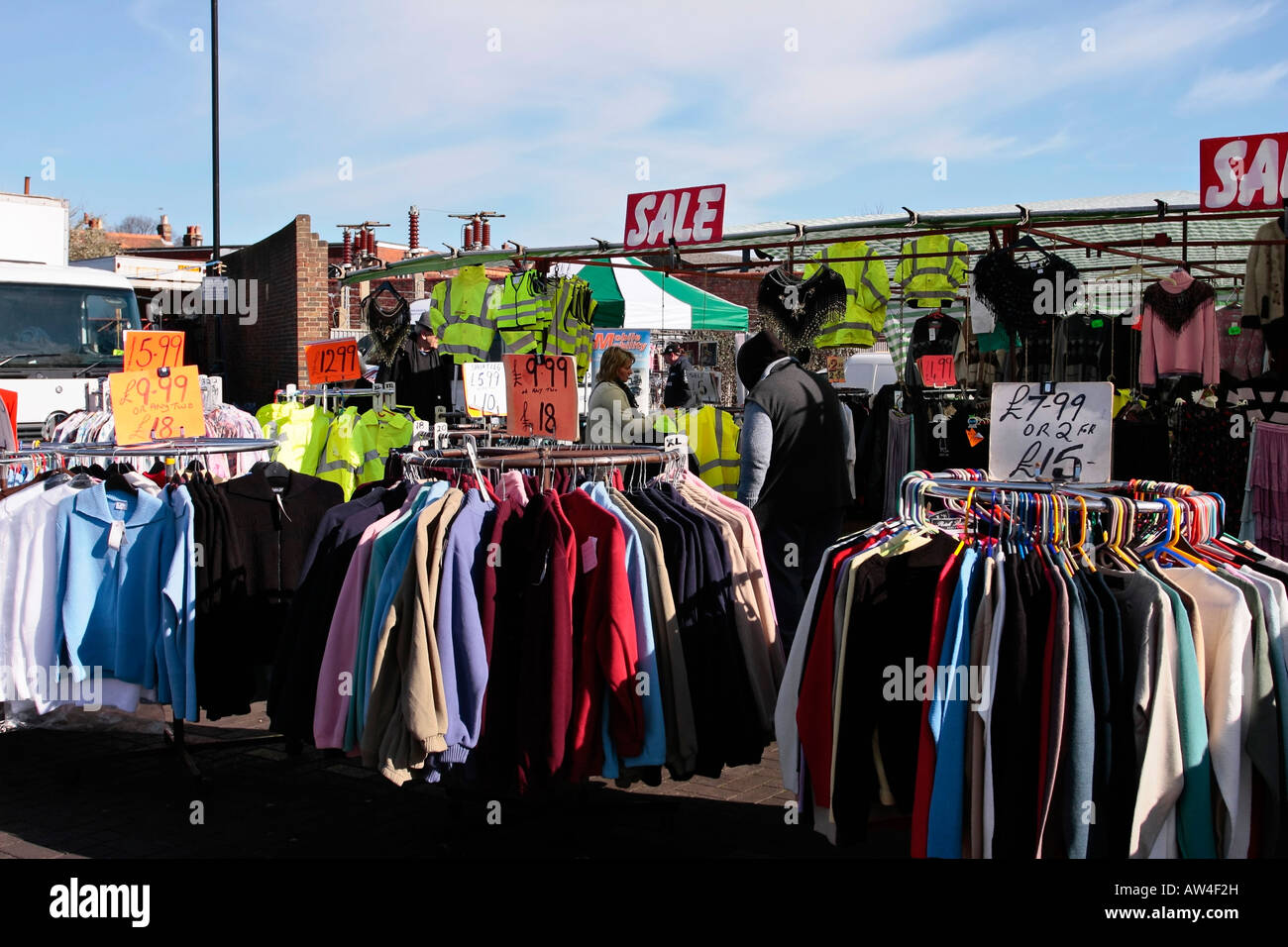 Clothing stall at Chichester Market, Sussex, England Stock Photo
