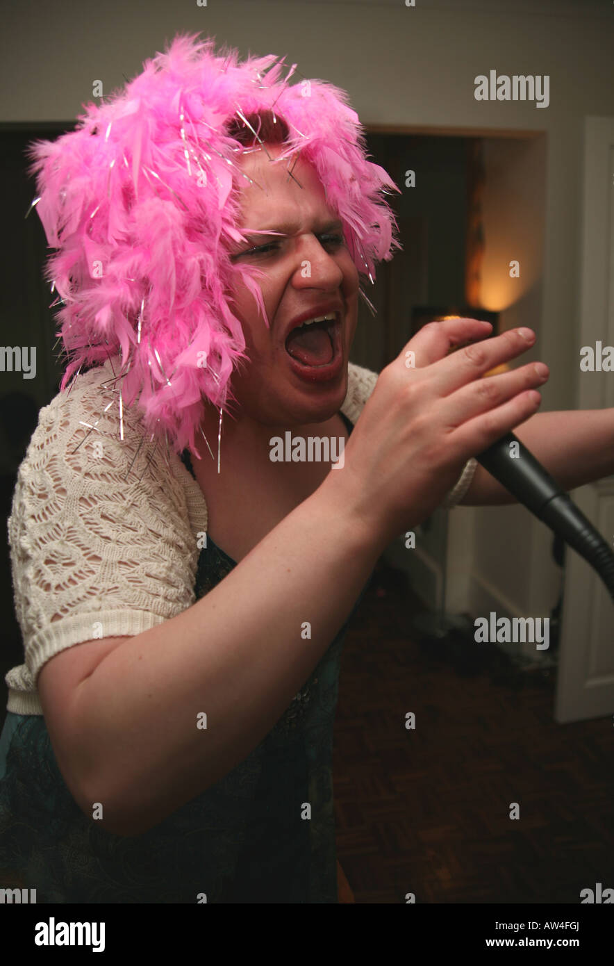 Someone Rapping Draq drunk man in drag singing on karaoke Stock Photo - Alamy
