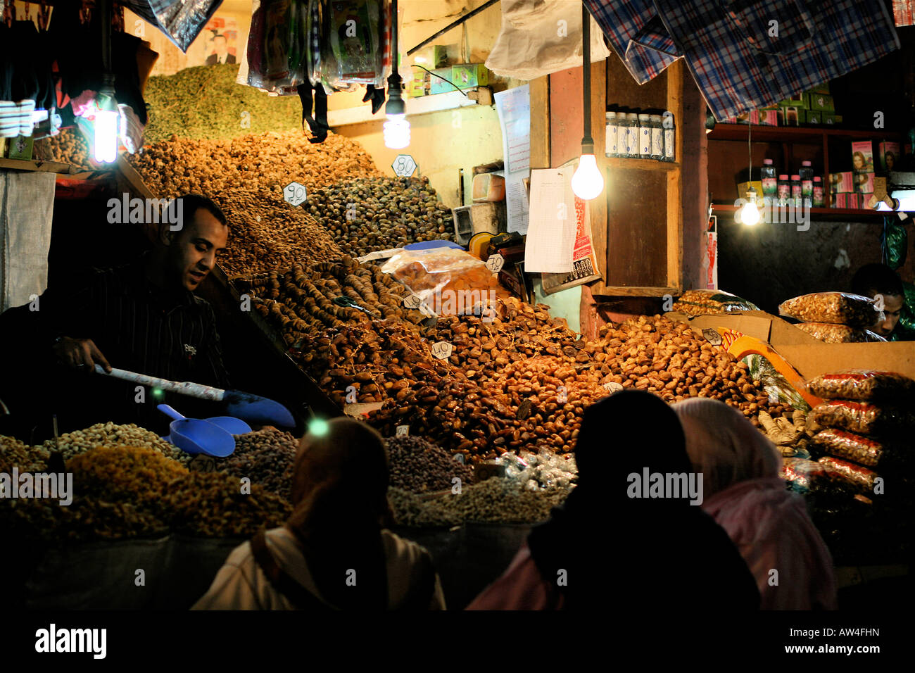 Market stall lit by lamps in the souk Marrakech, Morocco Stock Photo