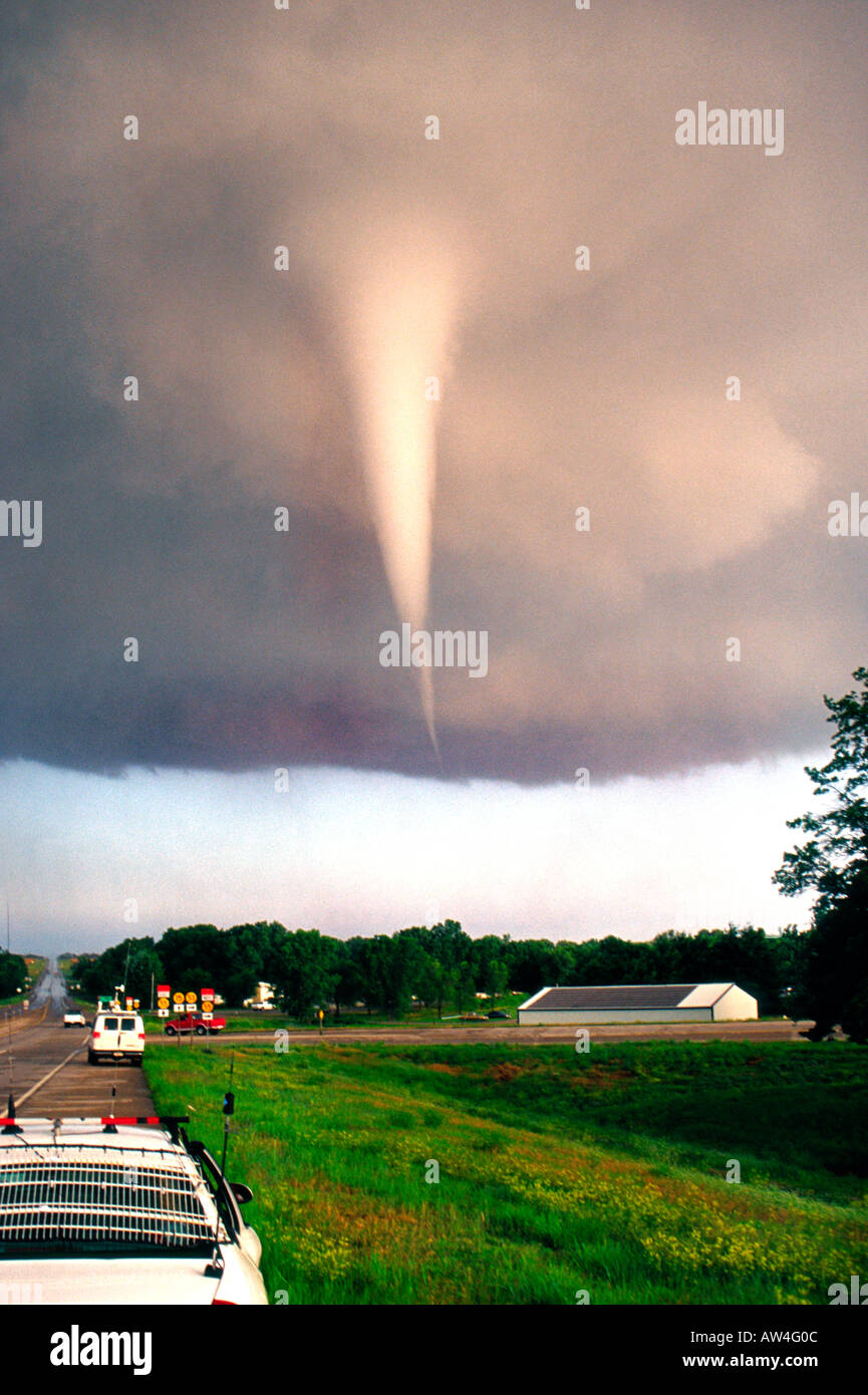 White tornado forms from swirling supercell thunderstorm near Mulvane, Kansas on June 12, 2004.  Storm chasers watch! Stock Photo
