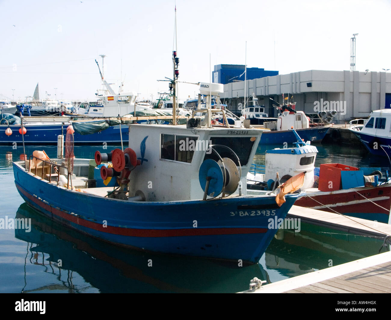 blue-and-white-fishing-boat-and-harbour-at-cambrils-costa-dorada