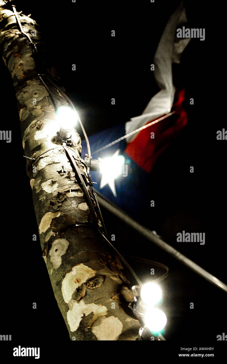 red, white and blue flag blowing at night with spotlights, abstract