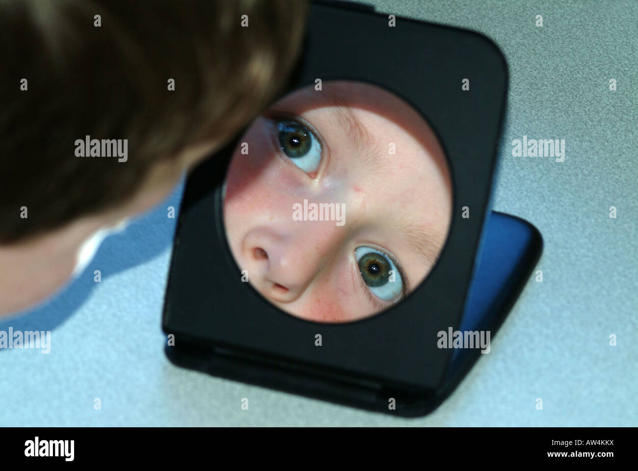 boy reflected in shaving mirror Stock Photo Alamy
