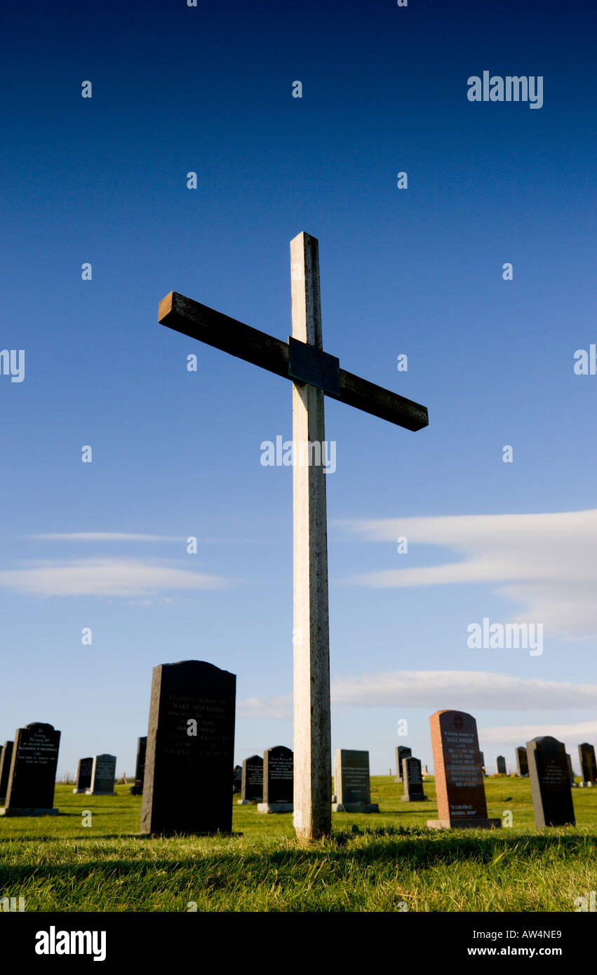 Simple cross on a grave in a cemetery Stock Photo