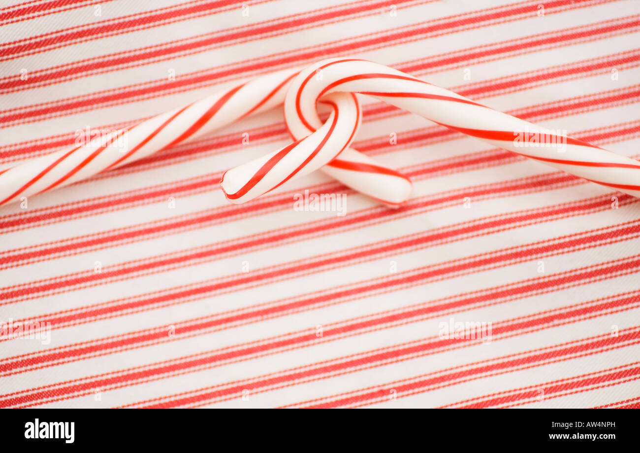 Two candy canes on a red and white background Stock Photo
