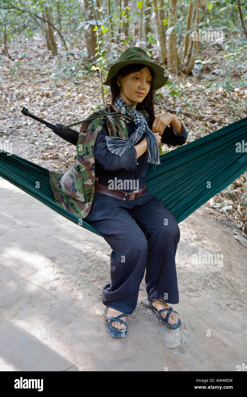 A mannequin of a female VIET CONG solider sits in a hammock in the CU CHI tunnels exhibit in HO CHI MINH CITY SAIGON VIETNAM Stock Photo