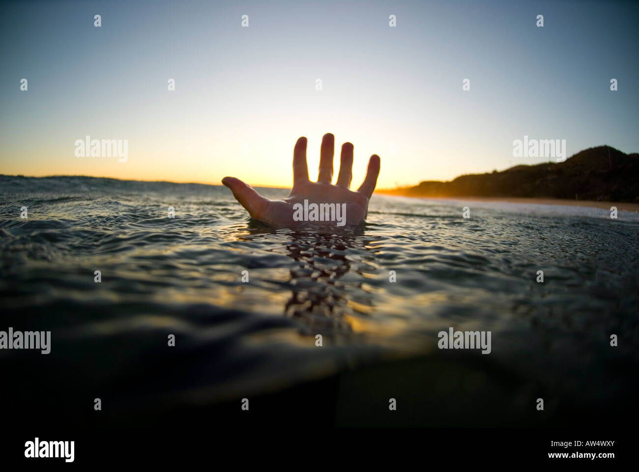 A male s hand in the water Stock Photo
