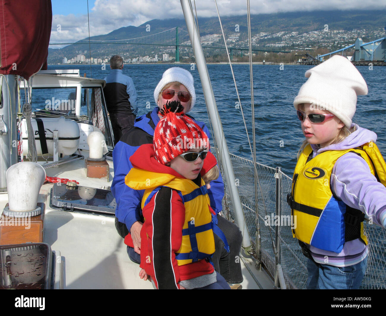 Family out on a sailboat ride West Vancouver, BC, Canada Stock Photo