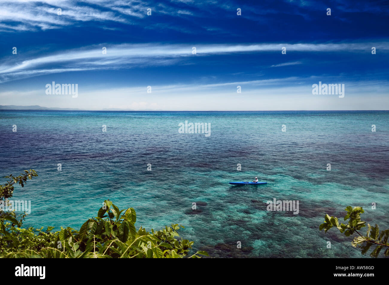 A man canoeing at sea Stock Photo - Alamy