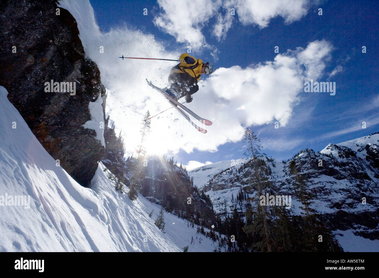 Skier jumps from large cliff, San Juan Range Stock Photo