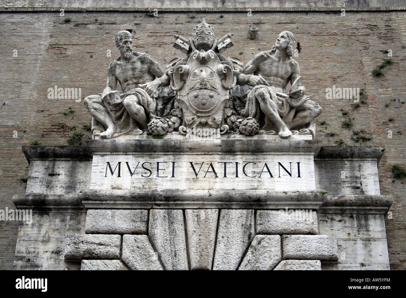 Statue over doorway into Vatican Museum Rome Italy Stock Photo