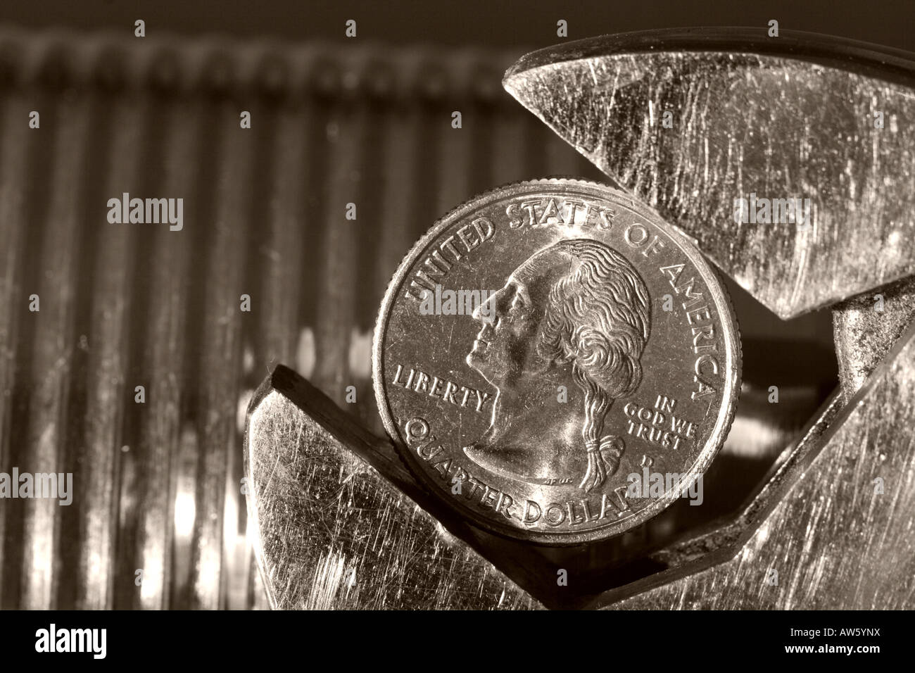 US quarter dollar coin in an industrial setting in an adjustable spanner tool Stock Photo