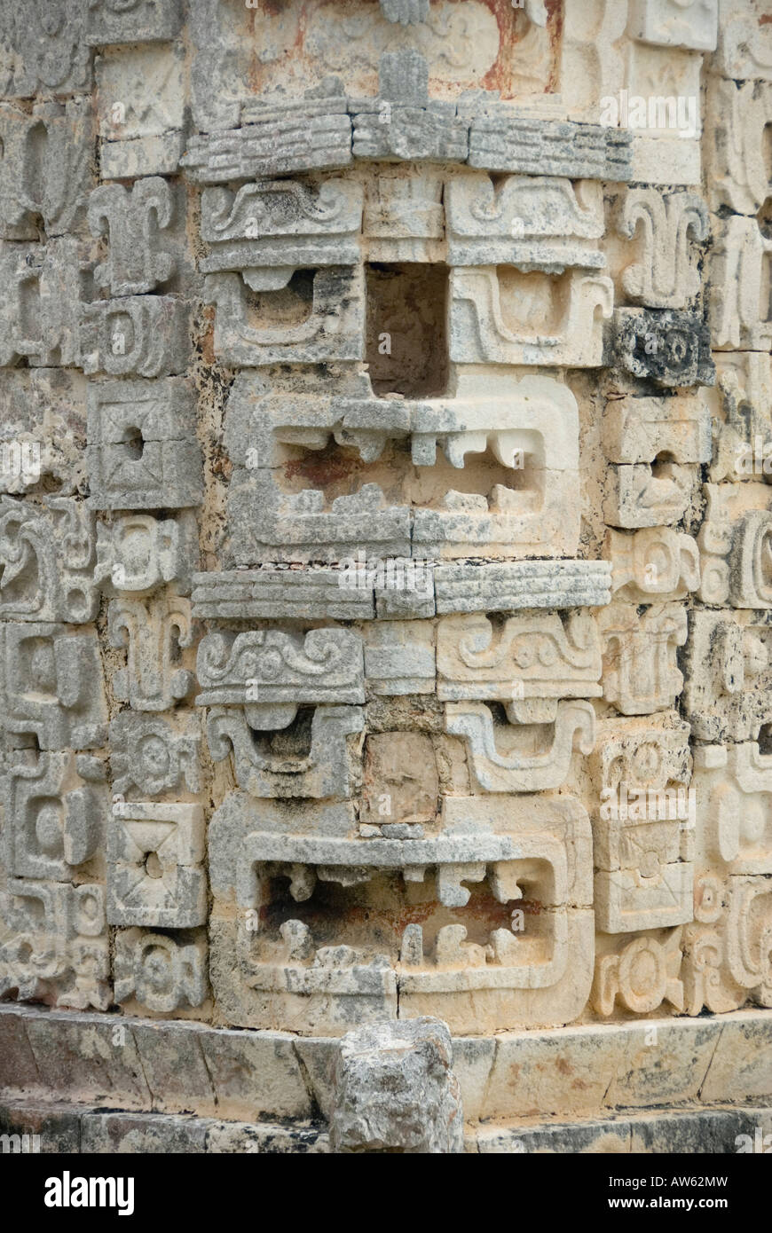 Uxmal, Mexico - 19 Jan 2007:  Two ornately carved  Chaac Rain God heads with missing noses, Casa de las Monjas or The Nunnery Stock Photo