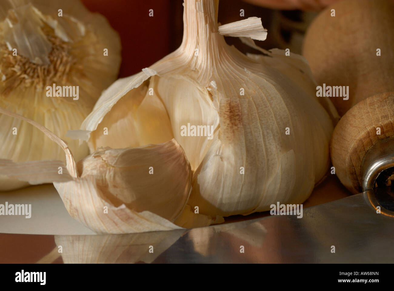 clove of garlic with a knife Stock Photo Alamy