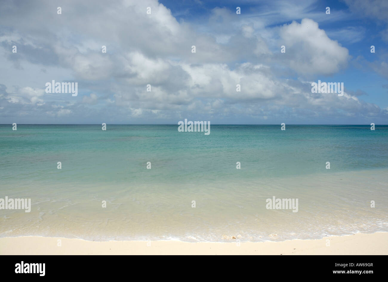 A view of the clear blue waters of the Indian Ocean from one of the pristine beaches on Denis Island in The Seychelles Stock Photo