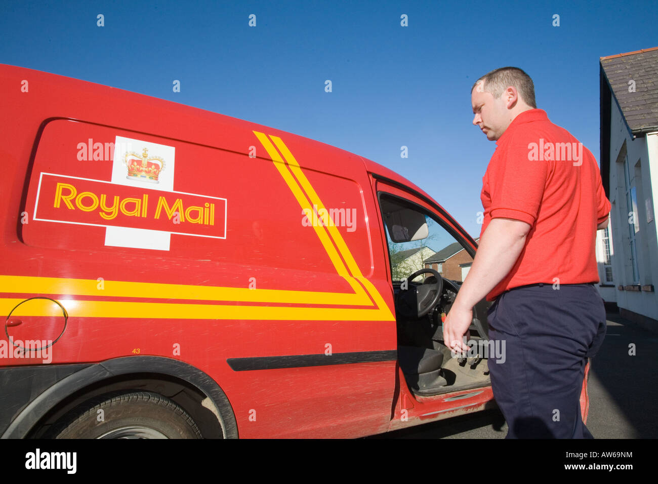 Postman post man working Red tee shirt GPO. Horizontal Narberth Post