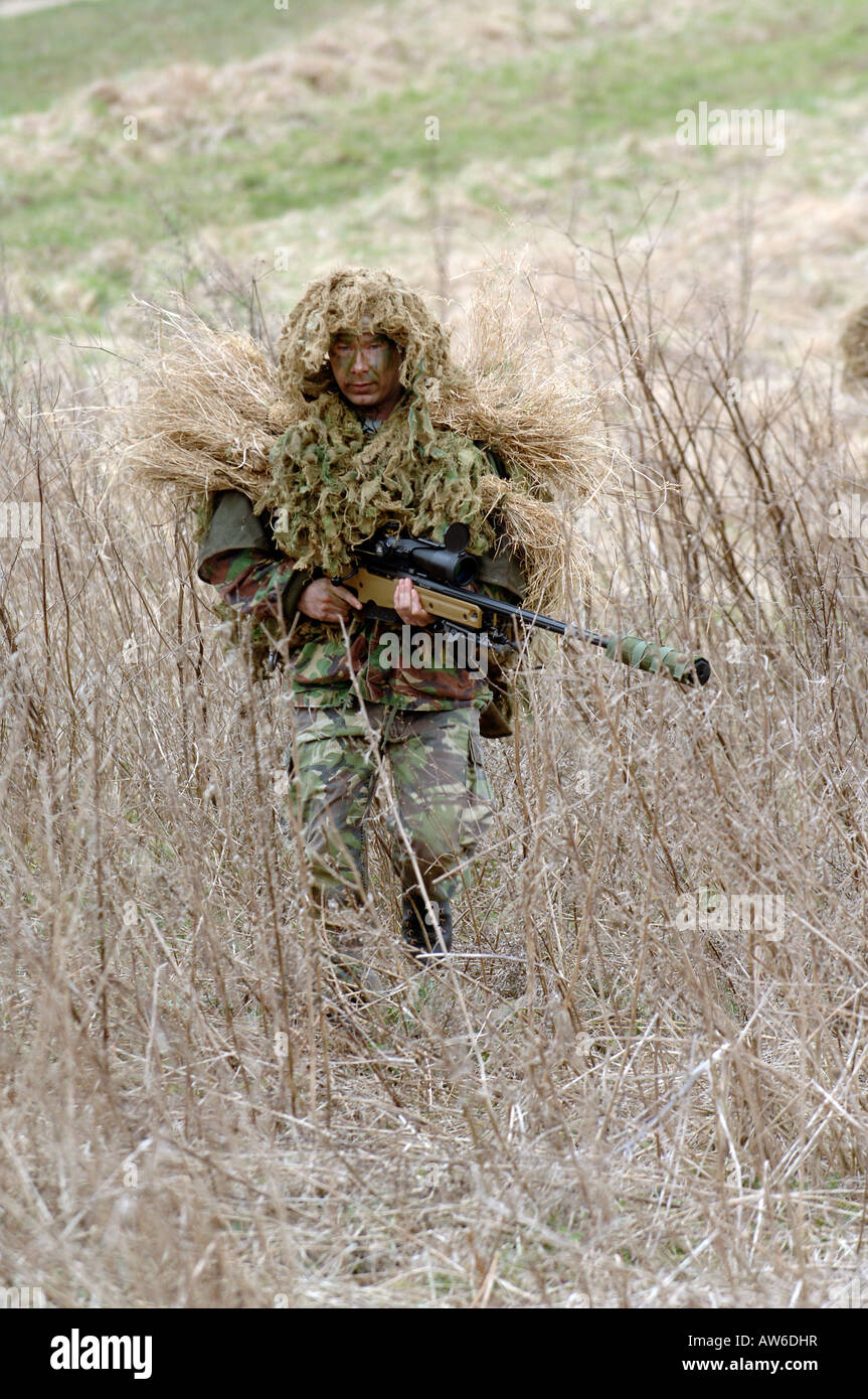 British Infantryman with a long range sniper rifle L115A3 which has a killing capability from over a mile. Stock Photo