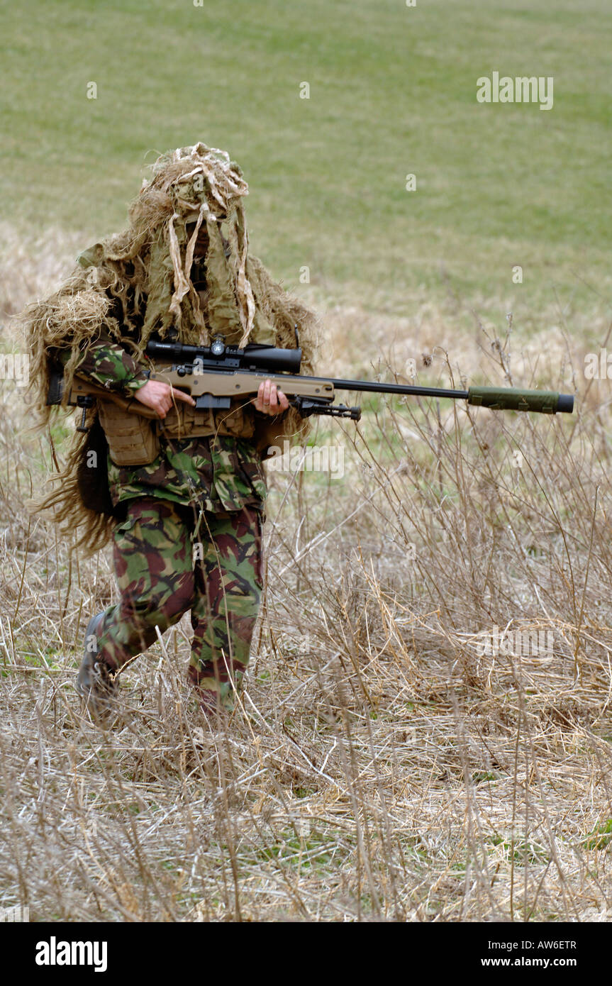 British Infantryman with a long range sniper rifle L115A3 which has a killing capability from over a mile. Stock Photo
