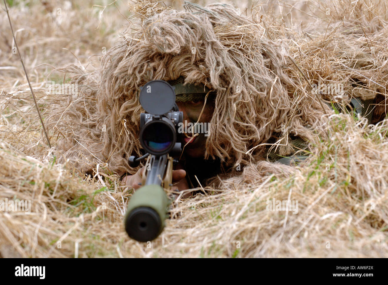 British Infantryman with a long range sniper rifle L115A3 which has a killing capability from over a mile. Stock Photo