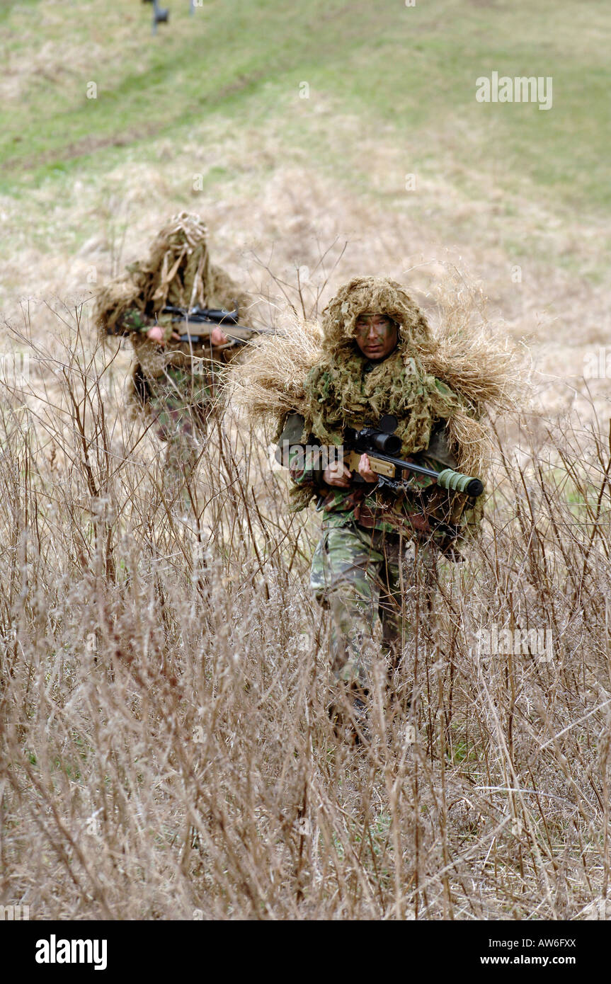 British Infantryman with a long range sniper rifle L115A3 which has a killing capability from over a mile. Stock Photo