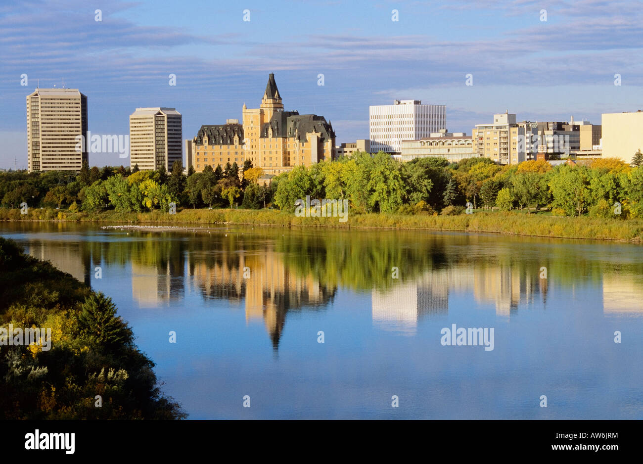 Downtown Saskatoon reflected in the South Saskatchewan river Stock Photo