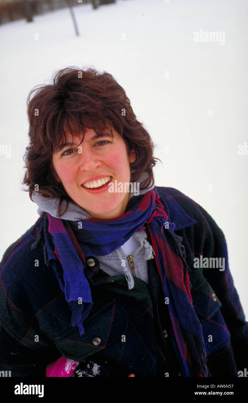 Beautiful mother age 31 worn out on weekend sledding expedition. St Paul Minnesota USA Stock Photo