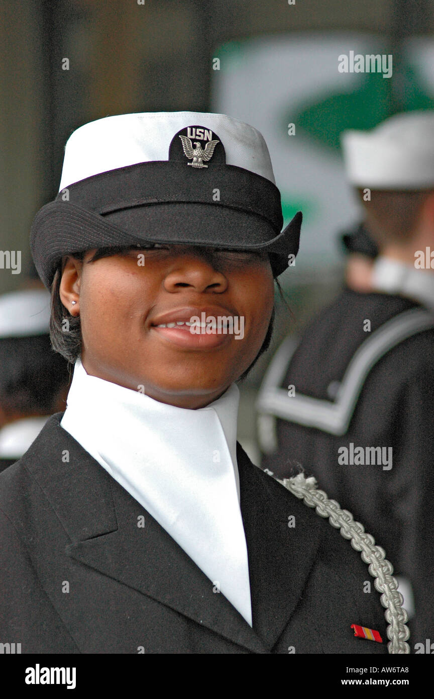 Real high school female girl Students in the real Navy Navel ROTC Military corps marching with the flags at parade in Atlanta Georgia USA America Stock Photo
